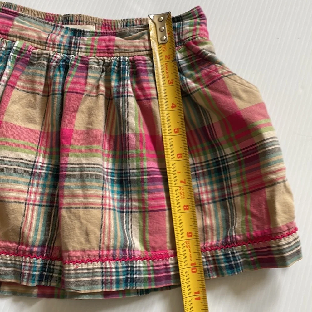 Cherokee tan, pink & blue plaid skirt.  Girls size small 6 - 6x
